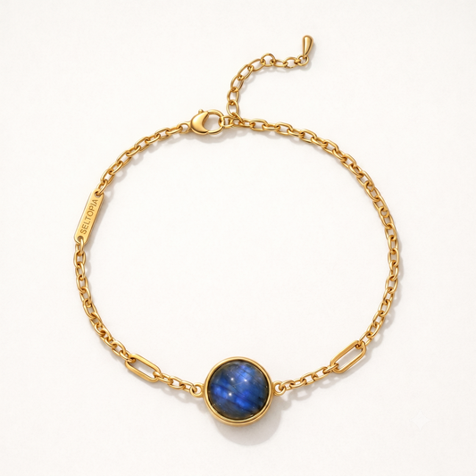 Cora labradorite bracelet — gold-chain NFC smart jewelry with a deep blue labradorite stone for grounding and transformation