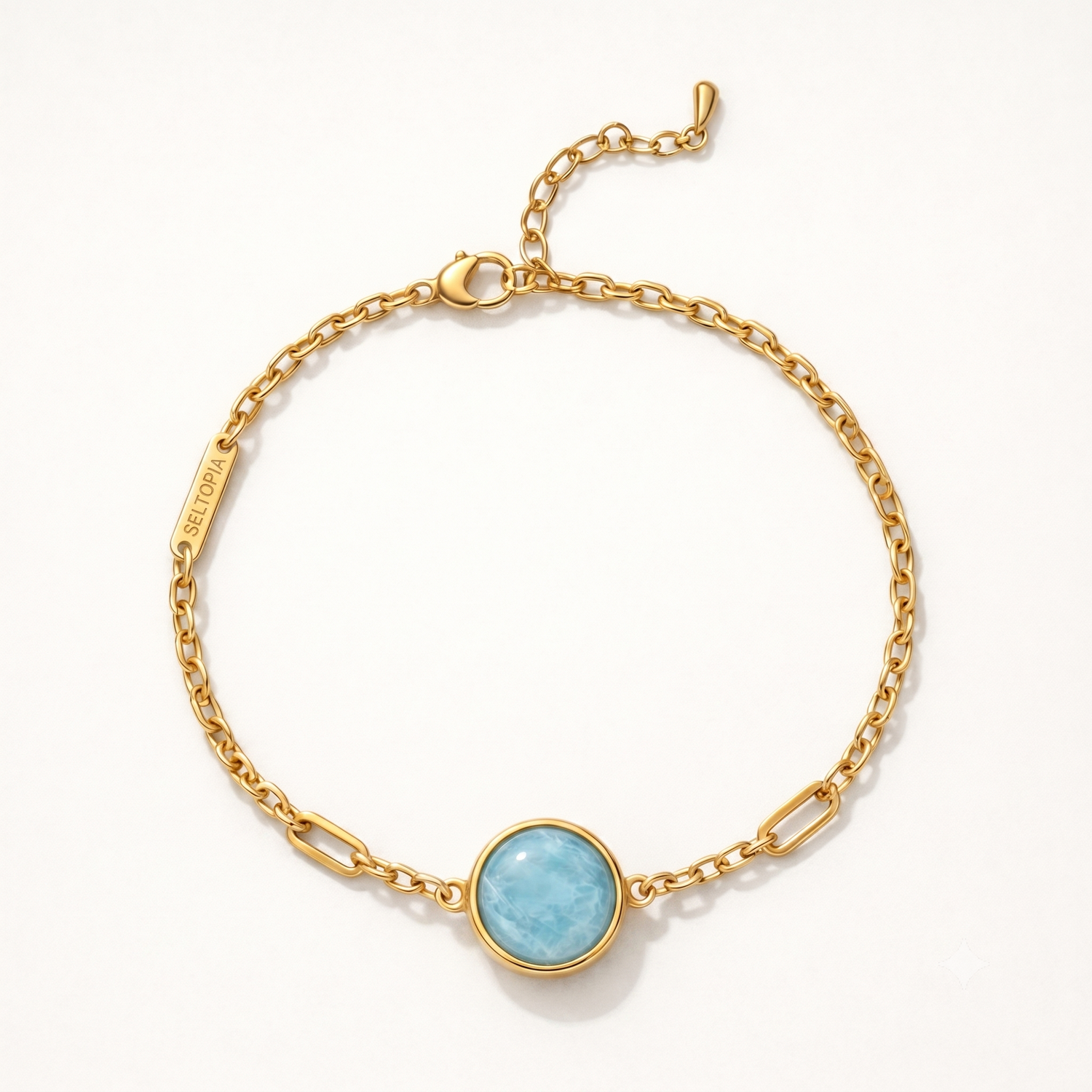 Cora aquamarine bracelet — gold-chain NFC smart jewelry with a pale blue aquamarine stone for calm and clear communication