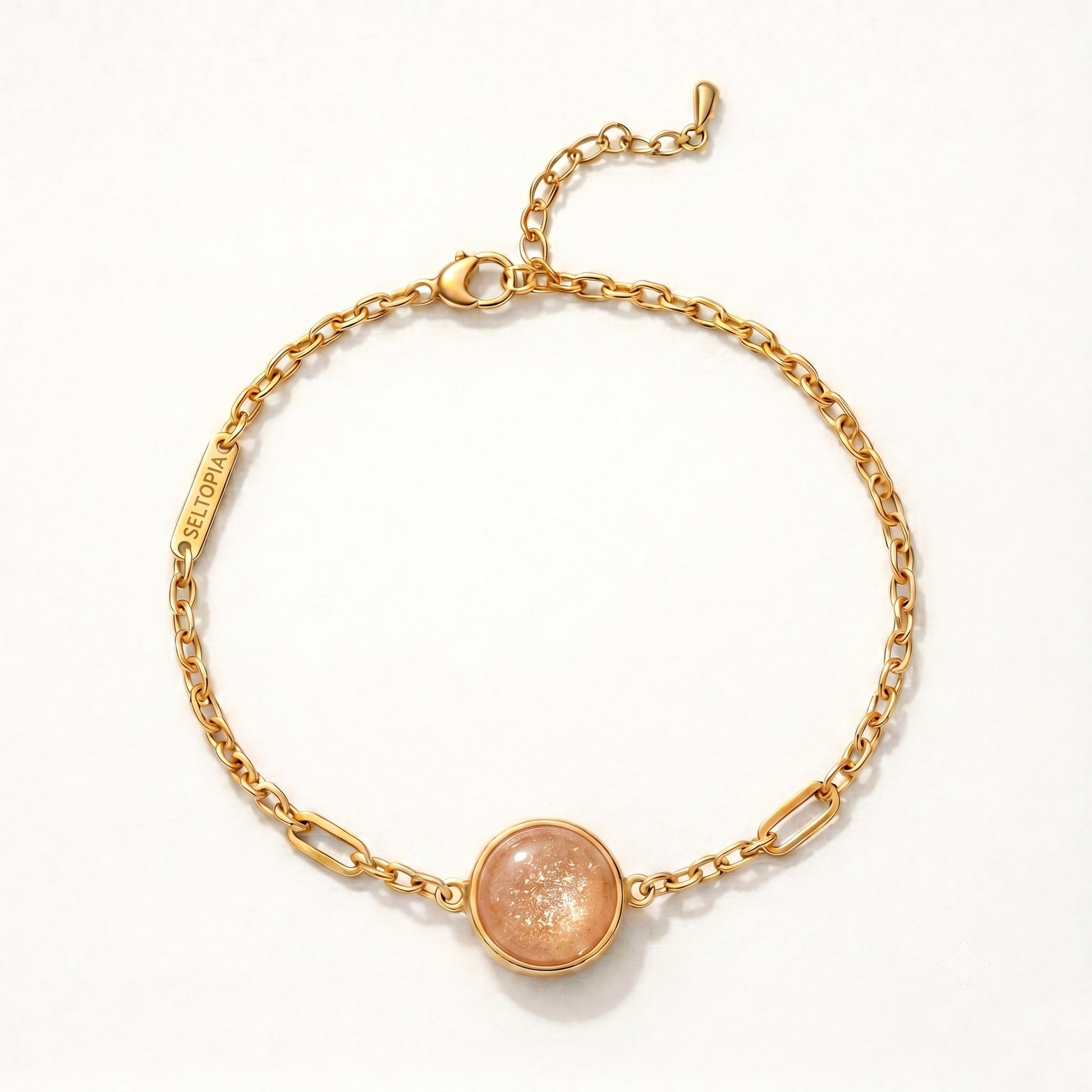 Cora sunstone bracelet — gold-chain NFC smart jewelry with a warm sunstone for confidence and energy